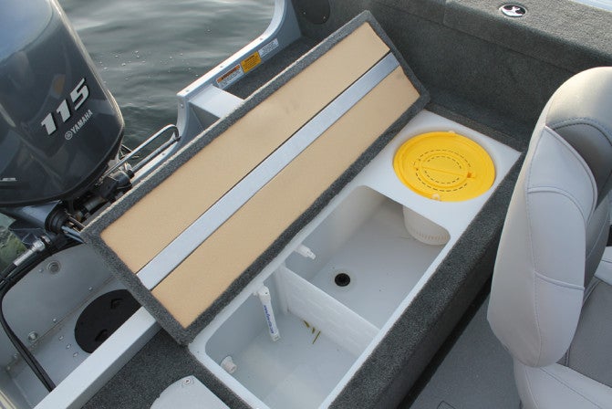 The 25-gallon live well mounted in the stern cam be divided in a tournament, and includes an integrated minnow bucket.