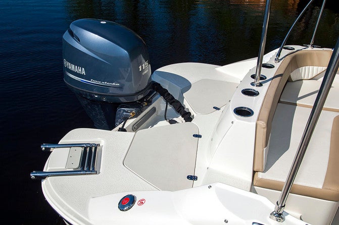 An expansive rear swim platform includes a retractable boarding ladder on the starboard side.